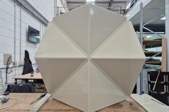 Large precision fabricated geometric structure manufactured using CNC routing techniques